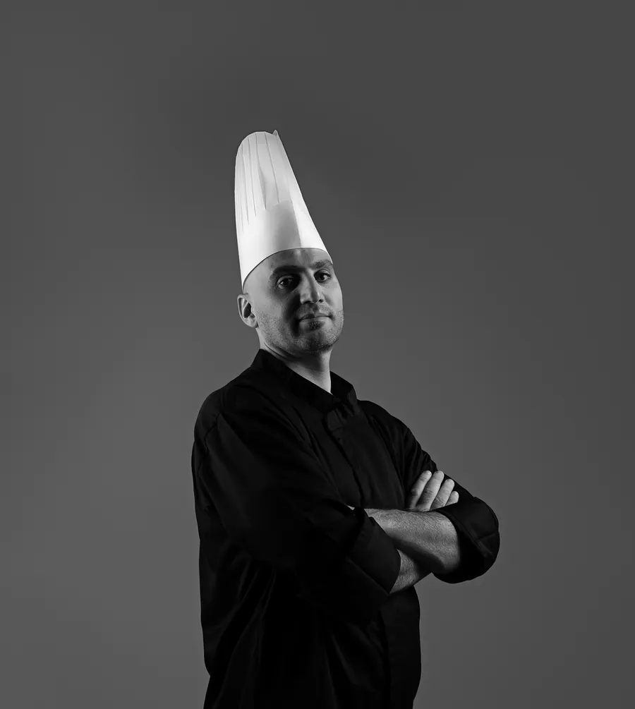 Chef Ali Nofal in a chef's toque