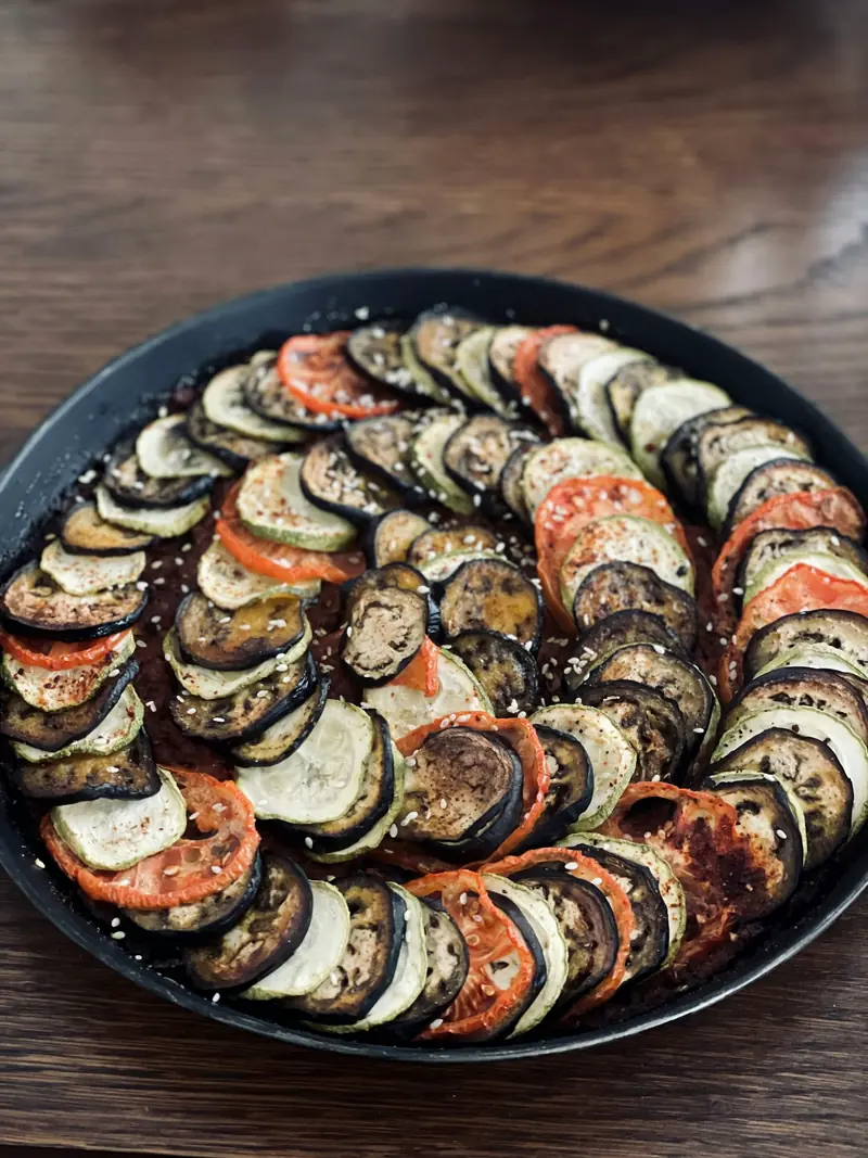 Ratatouille of aubergine, courgette and tomato slices